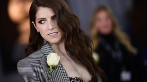 Anna Kendrick wearing a white rose