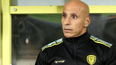 Dino Maamria in the dugout for Burton