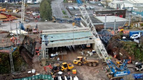 Railway bridge being moved into place