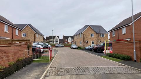 A general view of Leveret Gardens in Stowmarket. Cars can be seen parked outside homes.