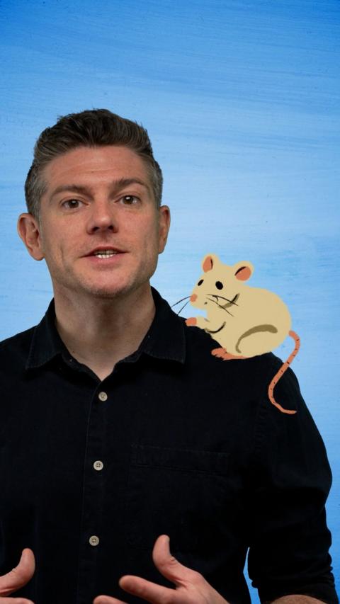 Professor Jonathan Swann with an illustrated mouse on his shoulder 
