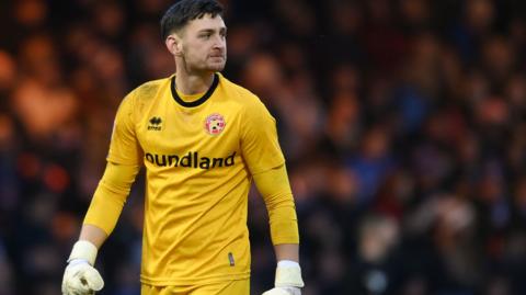 Goalkeeper Jackson Smith in action for Walsalll