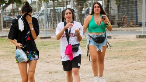 Young girls leave the Medusa Festival in Cullera, near Valencia. Photo: 13 August 2022