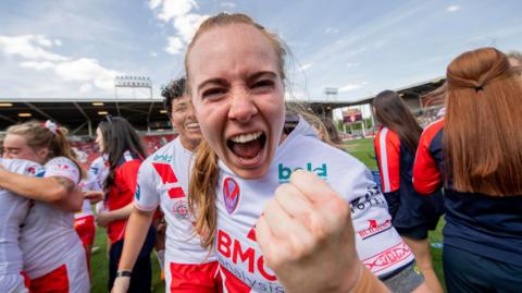 St Helens winger Dani McGifford roars happily into the camera with a fist punching the air in delight after a Challenge Cup semi-final win over York