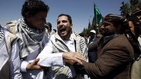 A Houthi supporter freed under a prisoner swap with Yemen's government reacts as he meets relatives upon his arrival at Sanaa's airport (16 October 2020)