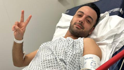Pouria Zeraati in hospital, following a stabbing attack