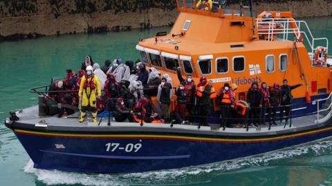 RNLI boat carrying people picked up from a small boat in the Channel