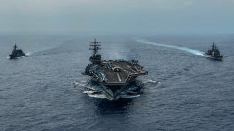 USS Ronald Reagan (CVN 76), Ticonderoga-class guided-missile cruiser USS Chancellorsville (CG 62) and Japan Maritime Self-Defense Force Akizuki-class destroyer JS Fuyuzuki (DD 118) underway in formation while conducting a bilateral exercise. 27 Oct 2019