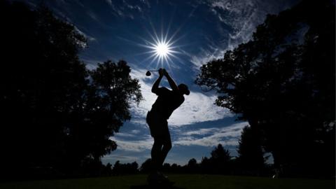 Golfer in silhouette