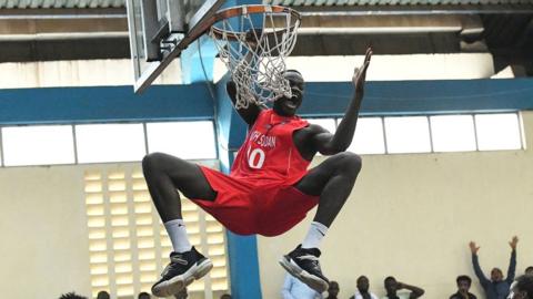 South Sudan's Makuei Puondak hangs on a ring