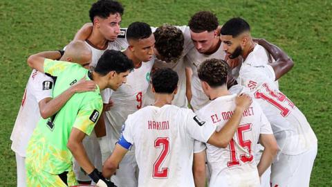 Morocco's players in a huddle