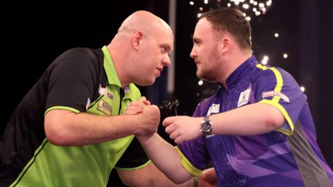 Michael van Gerwen and Luke Littler during the 2024 Premier League Darts in Leeds