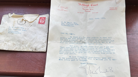 The letter is on plain white paper with the hotel's address at the top and it is is addressed to J R Gwilt on Stafford Road. The slightly dirty envelope is next to it.