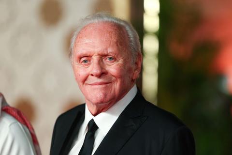 Sir Anthony Hopkins in a dark suit and tie