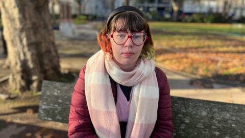 Kerrie Portman sat on a park bench