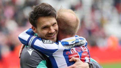 Danny Rohl hugs Barry Bannan