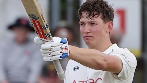 Ben McKinney celebrates scoring century
