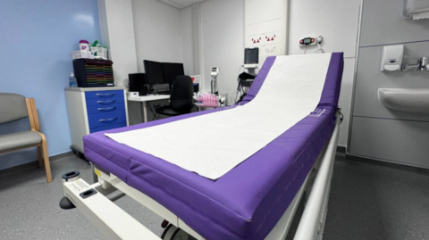 Bed in hospital maternity ward