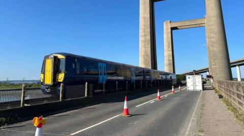 A Southeastern train crossing the Kingsferry bridge