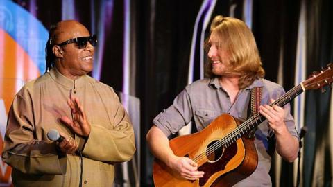 Stevie Wonder and Grayson Erhard on stage