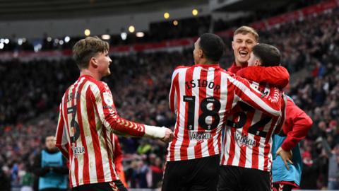 Sunderland players congratulate Trai Hume on scoring versus Plymouth