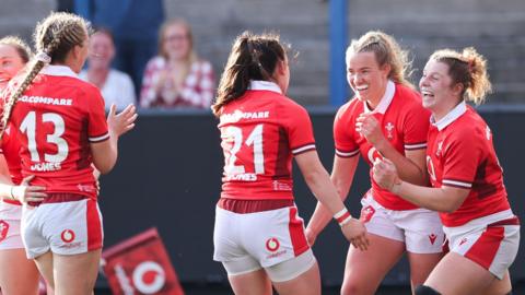 Wales players celebrate a try against Spain