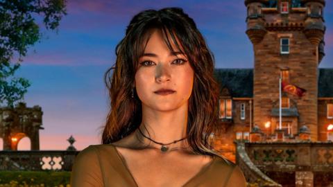 Official Traitors shot of Jade in front of the Scottish castle where the series is filmed