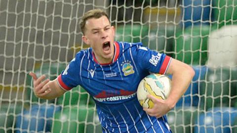 Kyle McClean celebrates scoring Linfield's equaliser against Cliftonville