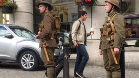 Soldiers appear in Belfast near the Europa Hotel