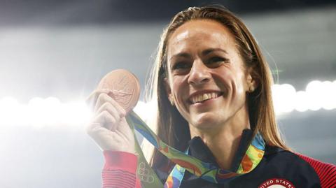 Jenny Simpson holds up her bronze medal at the Rio Games in 2016