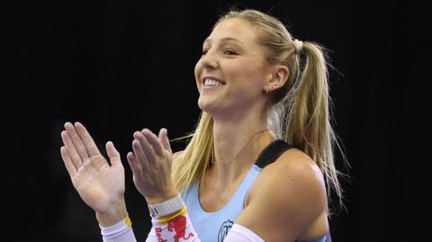 Molly Caudery celebrates during the women's pole vault final at the UK Athletics Indoor Championships
