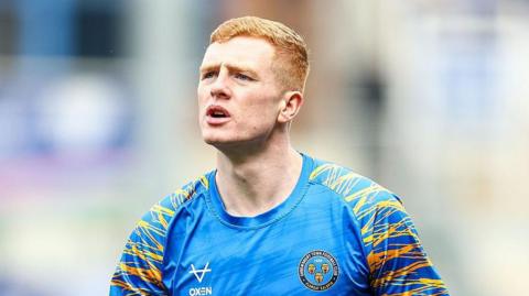 Morgan Feeney warming up for a match for Shrewsbury last season