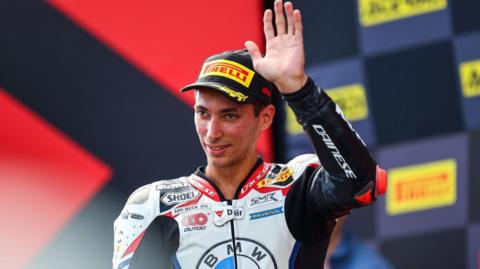 Toprak Razgatlioglu waves to the fans in Estoril after his race one win on Saturday