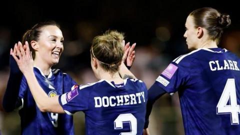 Scotland celebrate a goal by Caroline Weir (left)