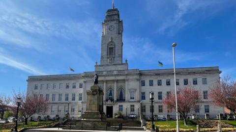 Barnsley town hall is a white stone building with a clock tower