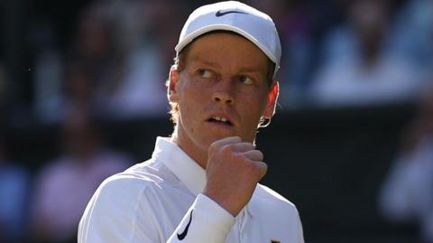 Jannik Sinner celebrates winning a point at Wimbledon in 2025