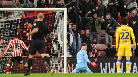 Illan Meslier looks at the ground after Sunderland's 97th-minute equaliser