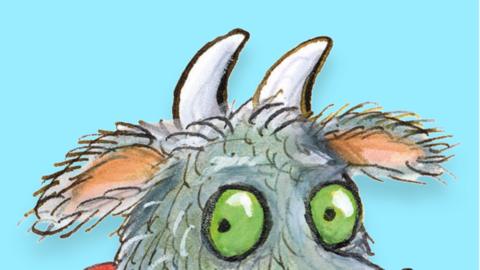A cropped image of the Gruffalo's granny showing her green eyes, green and blue fur and horns. 