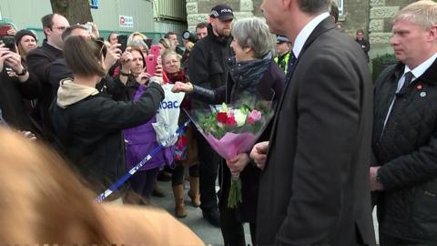 Theresa May fist bumping