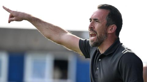 Christian Fuchs shouts instructions at Barrow on the final day of the season