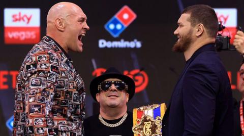 Tyson Fury screams at Arslanbek Makhmudov in jest at a news conference in London