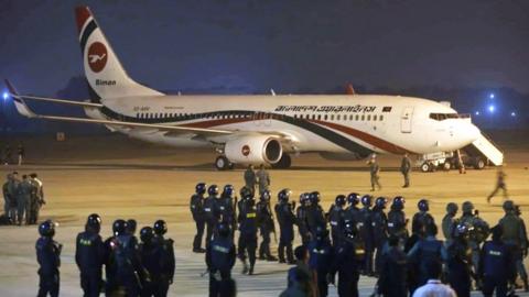 Police forces surround the hijacked Dubai-bound Bangladesh Biman plane on the tarmac after an emergency landing at the Shah Amanat International Airport in Chittagong, Bangladesh, 24 February 2019