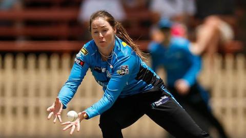 Amanda-Jade Wellington attempting to complete a catch while playing for Adelaide Strikers.