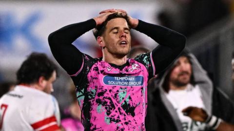 Kieran Hardy is dejected after Ospreys' defeat by Ulster