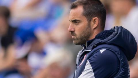 Reading boss Ruben Selles looks tense as he stands on the touchline and watches his team in League One.