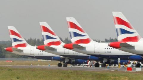 BA planes sitting on a runway