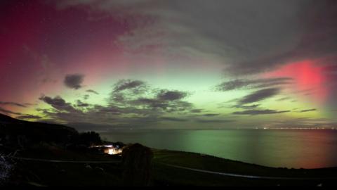 The aurora borealis can be seen when solar eruptions send particles towards Earth