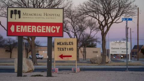 A sign in Gaines County, Texas, points to measles testing 