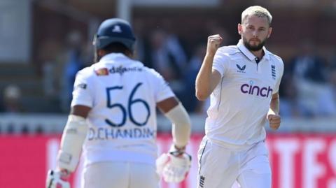 England bowler Gus Atkinson celebrates taking a wicket