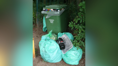 Bags of litter at the entrance to Burton Riggs Nature Reserve